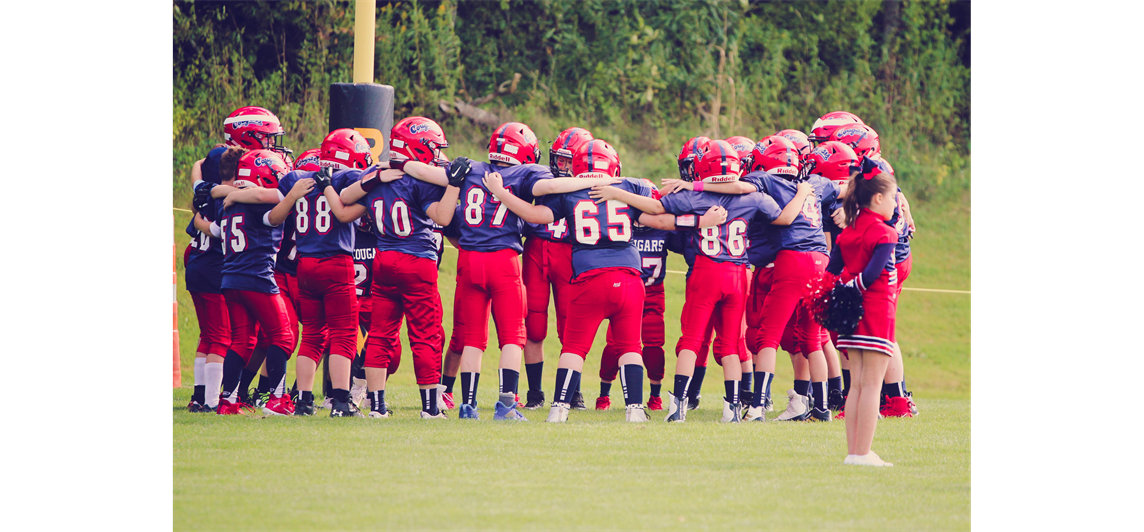 Junior Football Team Huddle